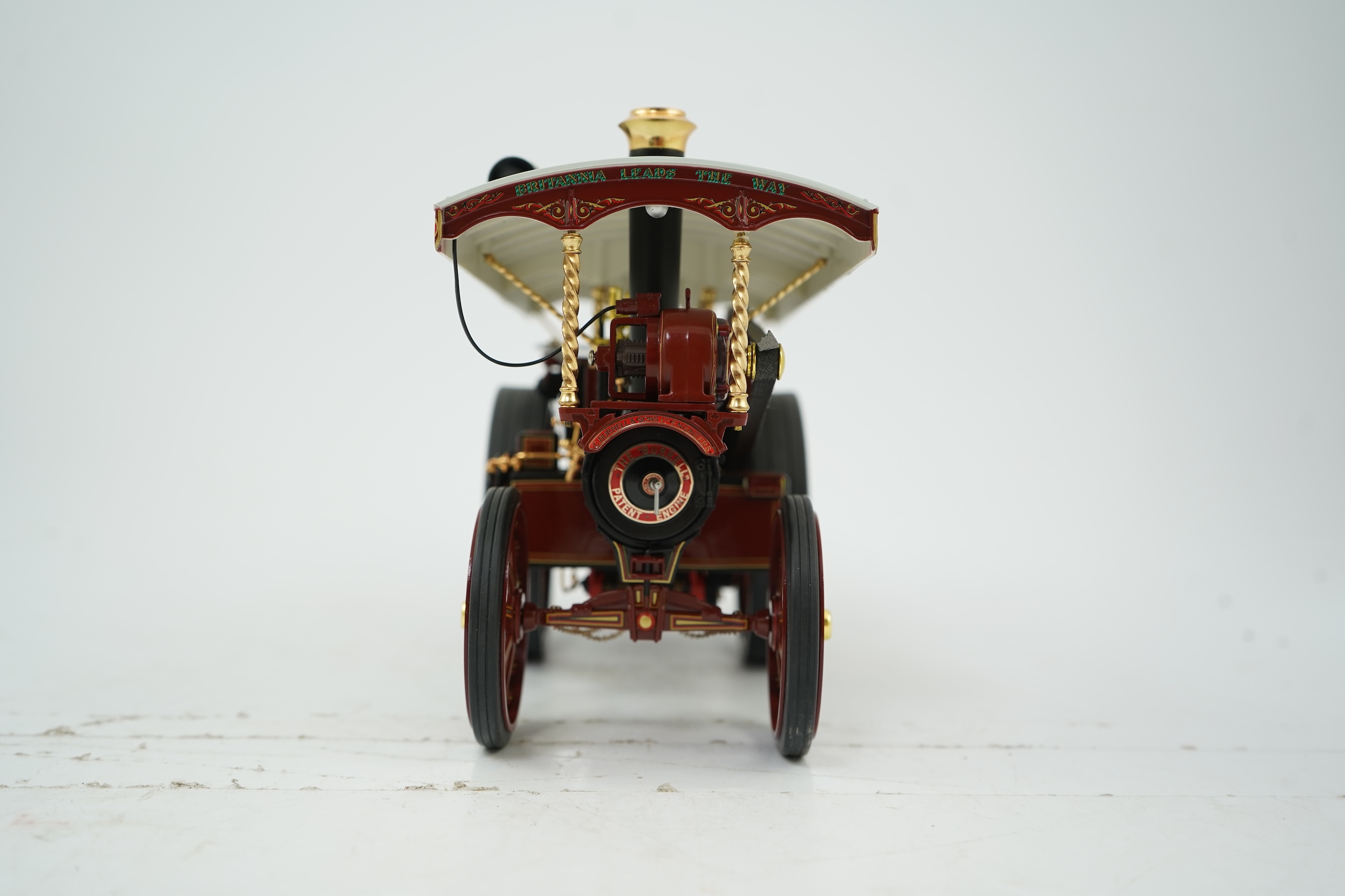 A Midsummer Models Ltd. 1:24 scale model of a Burrell Showman’s Engine, Britannia, in William Thurston and Son. Super Speed Cars livery, missing the original card box, but with an oak and Perspex display case